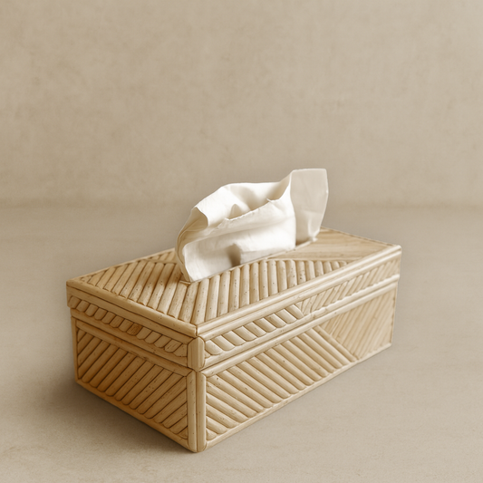 Beige woven tissue box with a tissue peeking out on a beige background