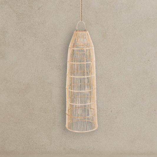 Woven rattan pendant light against a beige wall