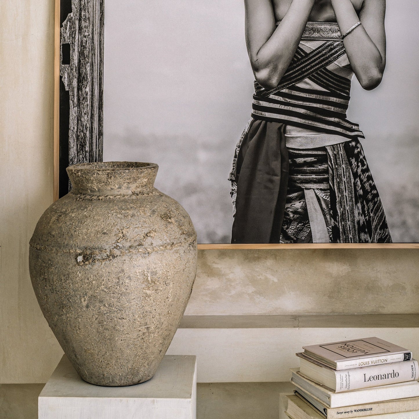 A terra cotta pot with hand-painted geometric patterns, indicative of cultural or artistic inspiration.