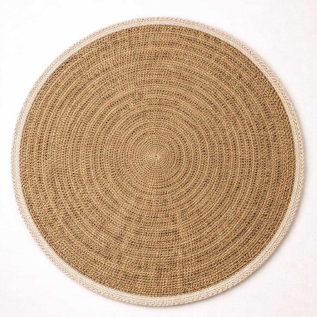 Round woven placemat with concentric circle pattern on a white background
