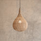 Woven pendant light hanging against a beige wall
