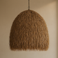 Textured brown pendant light against a beige background