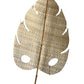 A handmade decorative palm leaf made from natural plant fibers, mounted on a bamboo stem.