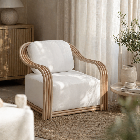White armchair with wooden frame in a cozy living room setting