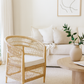 Nautical-themed room with a bed, nightstands, and decorative items.