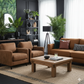 Modern living room with brown sofa, armchairs, and wooden coffee table.