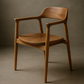 Wooden chair against a brown background